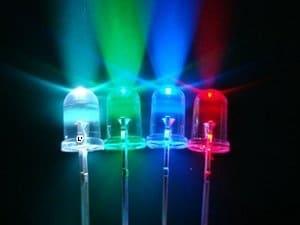 Four colored LED lights glowing in white, green, blue, and red.