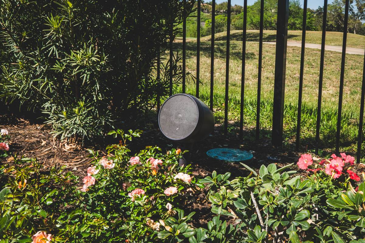Outdoor garden speaker in a flower bed