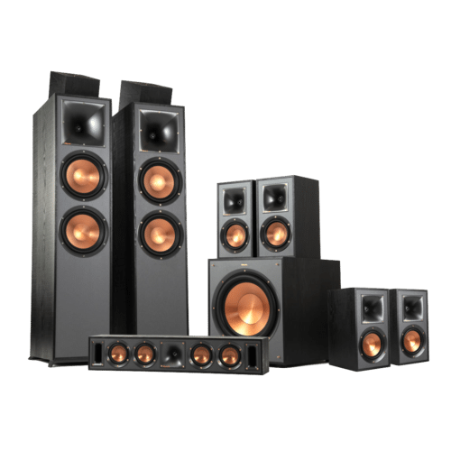 A complete home theater speaker system featuring two tall floor-standing speakers, a center channel speaker, a subwoofer, and multiple surround sound speakers, all with copper-colored speaker cones.