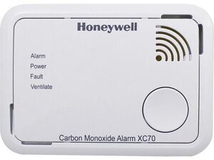 A Honeywell Carbon Monoxide Alarm XC70 with indicator lights and a test button.