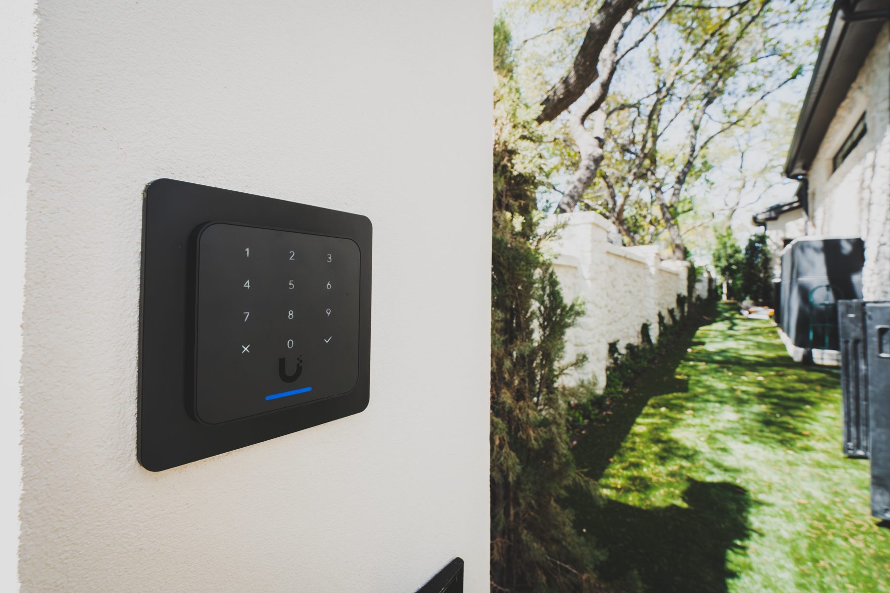 Keypad access reader on an exterior wall