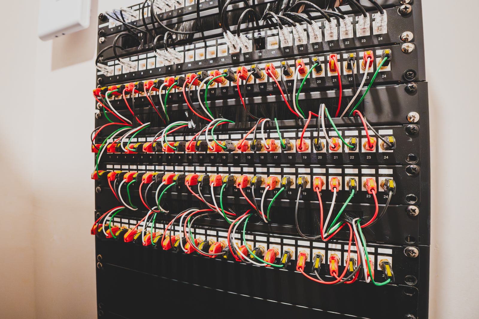 Network rack with patch panels and neatly dressed, color-coded cables